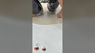 That’s epoxy colored sand floor paint. Not fragile. Not fading. Not peeling.
